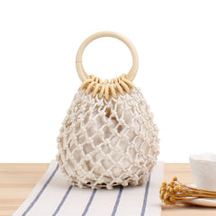 The new solid color net bag hand woven bag forest hand tied cotton thread hand carry seaside holiday beach bag